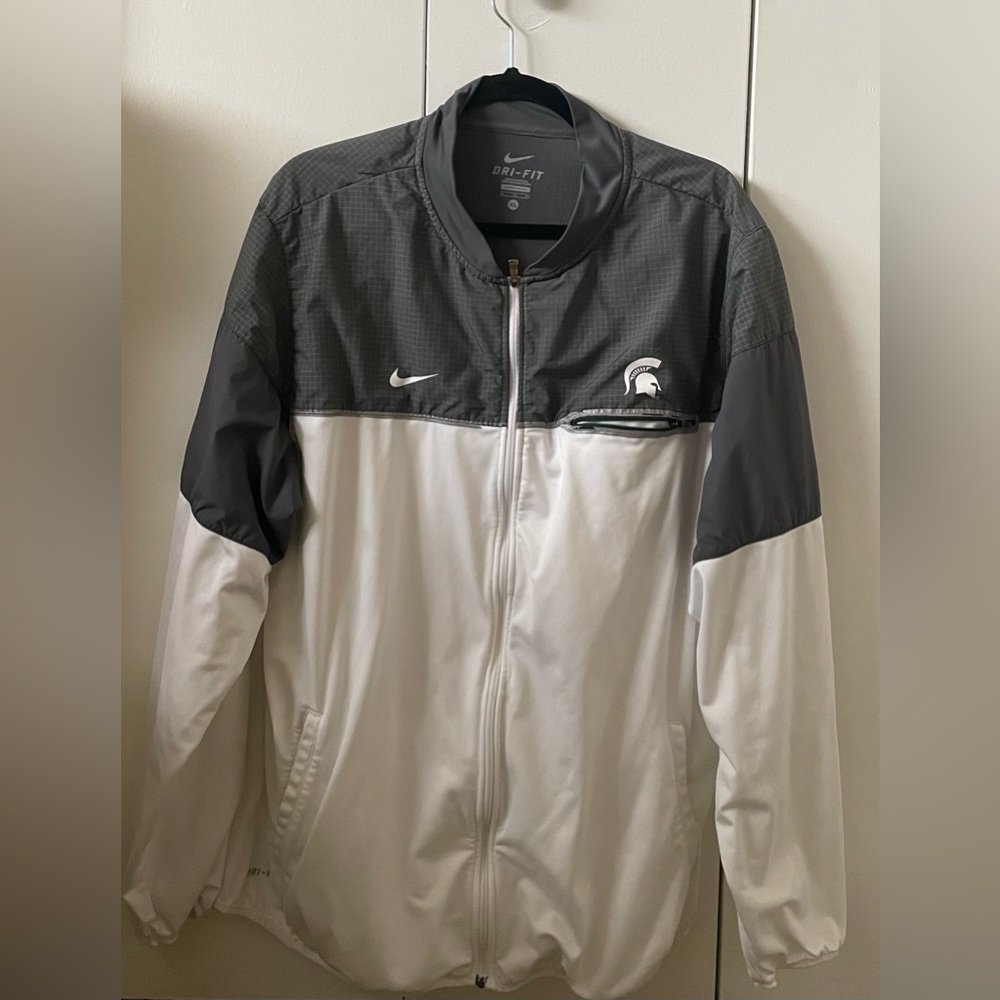 Fairly worn Michigan State Spartans wind jacket. see images for further details